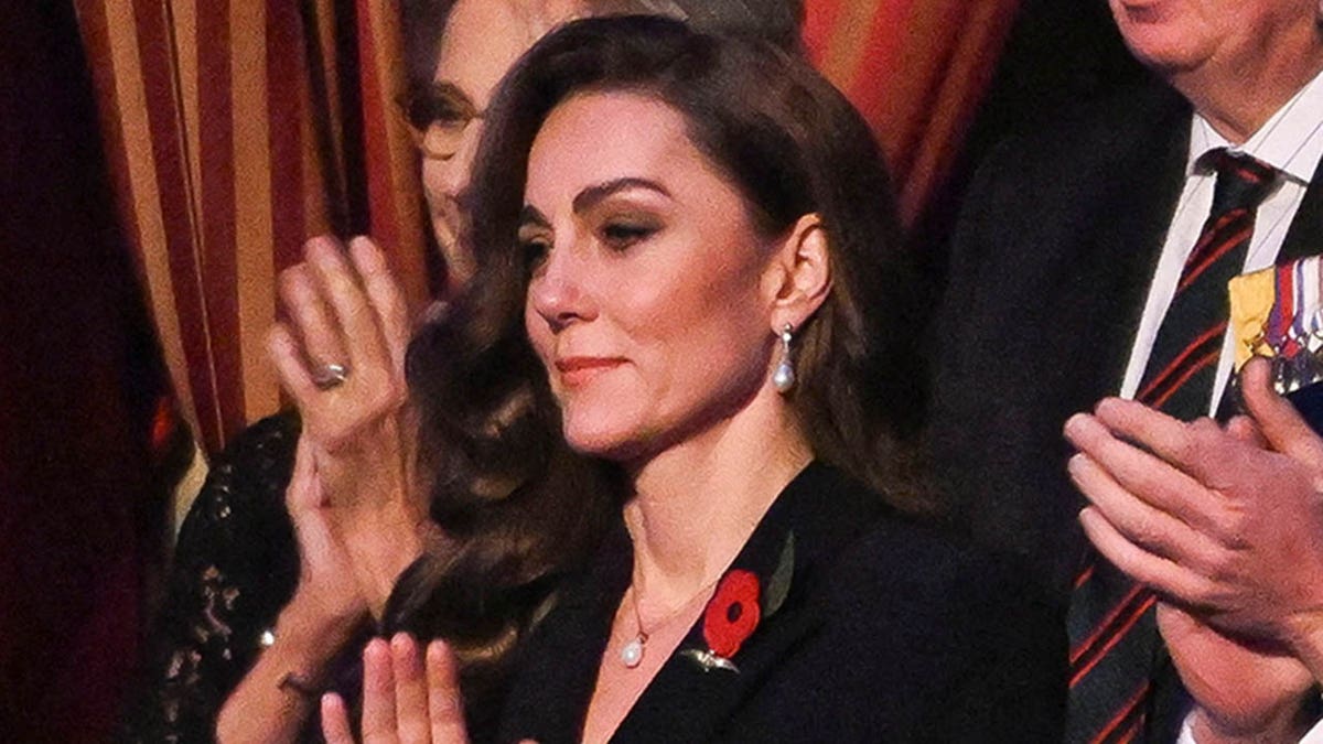 Kate Middleton claps at a memorial service