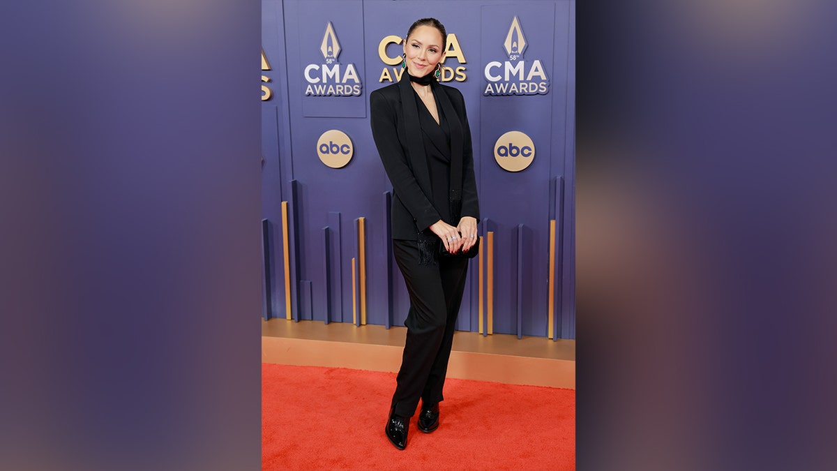 Katharine McPhee walked the red carpet at the 2024 CMA Awards in a black suit.