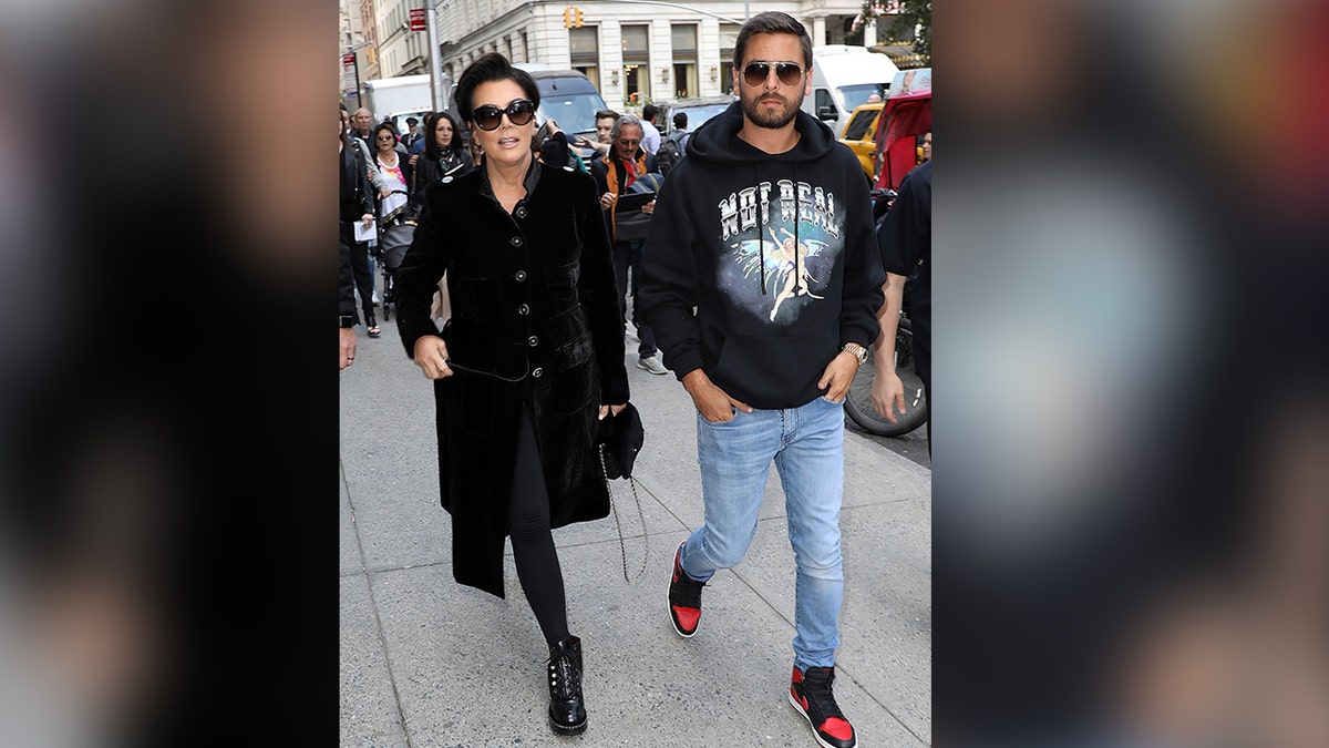 Kris Jenner successful  a achromatic  overgarment   walks alongside Scott Disick successful  a achromatic  sweatshirt and jeans successful  New York