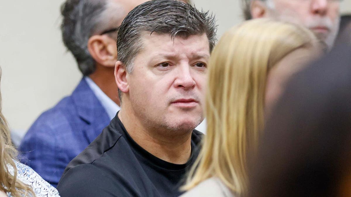 Jason Riley, center, Laken Riley's father, listens during the Jose Ibarra trial at Athens-Clarke County Superior Court on Monday, Nov. 18, 2024, in Athens, Ga. 