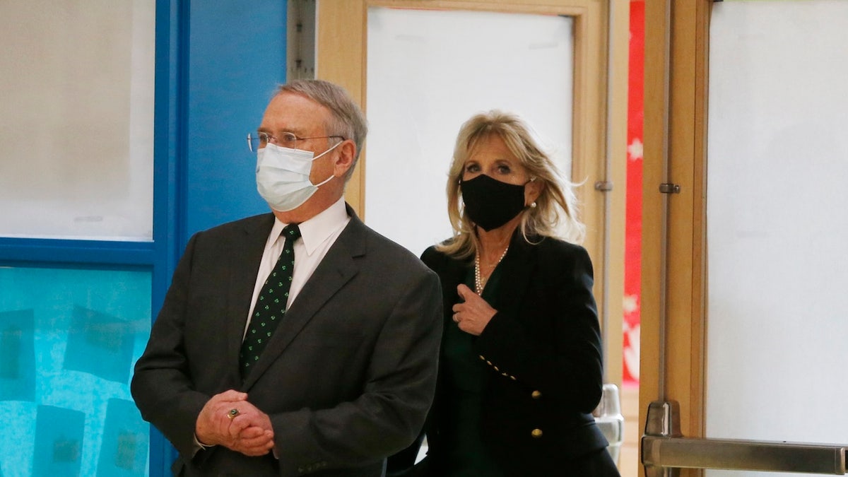 First Lady Dr. Jill Biden, right, and Steven J. McAuliffe