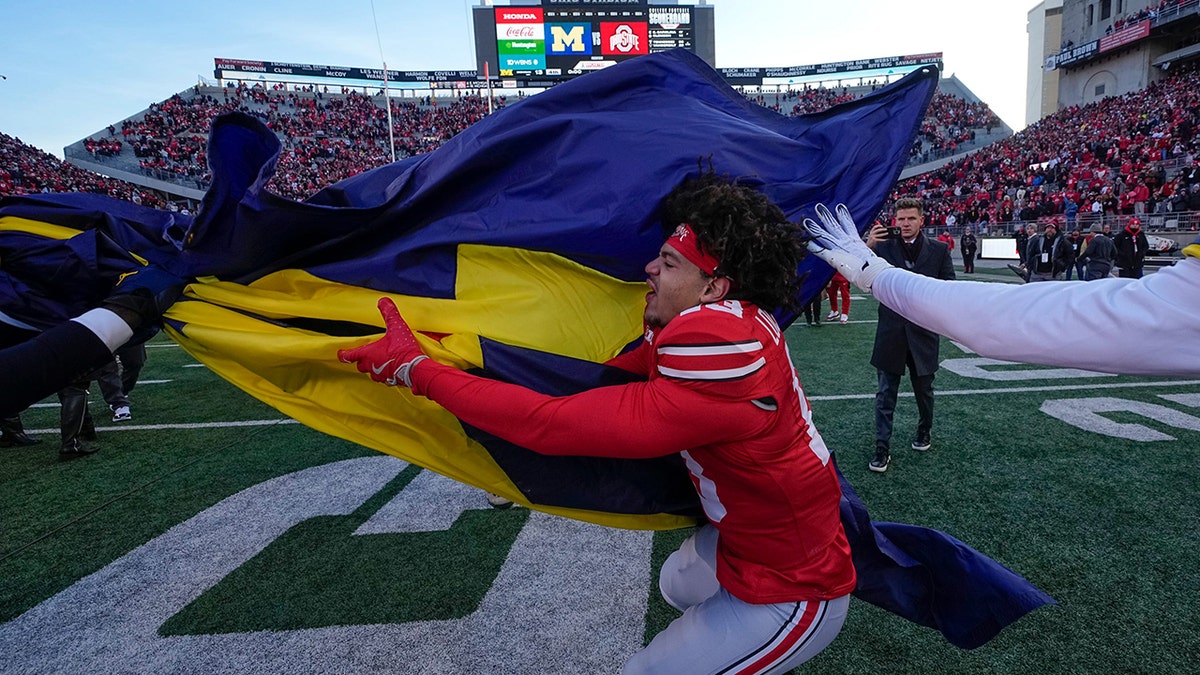 Miles Lockhart tries to grab flag