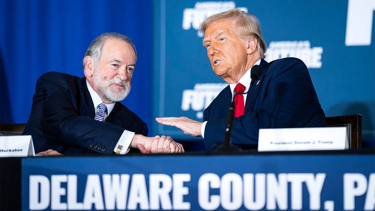 Former Arkansas Gov. Mike Huckabee and President-elect Donald Trump