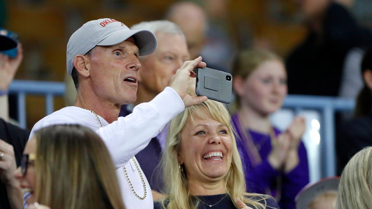 Brent Venables and his woman  ticker  a game