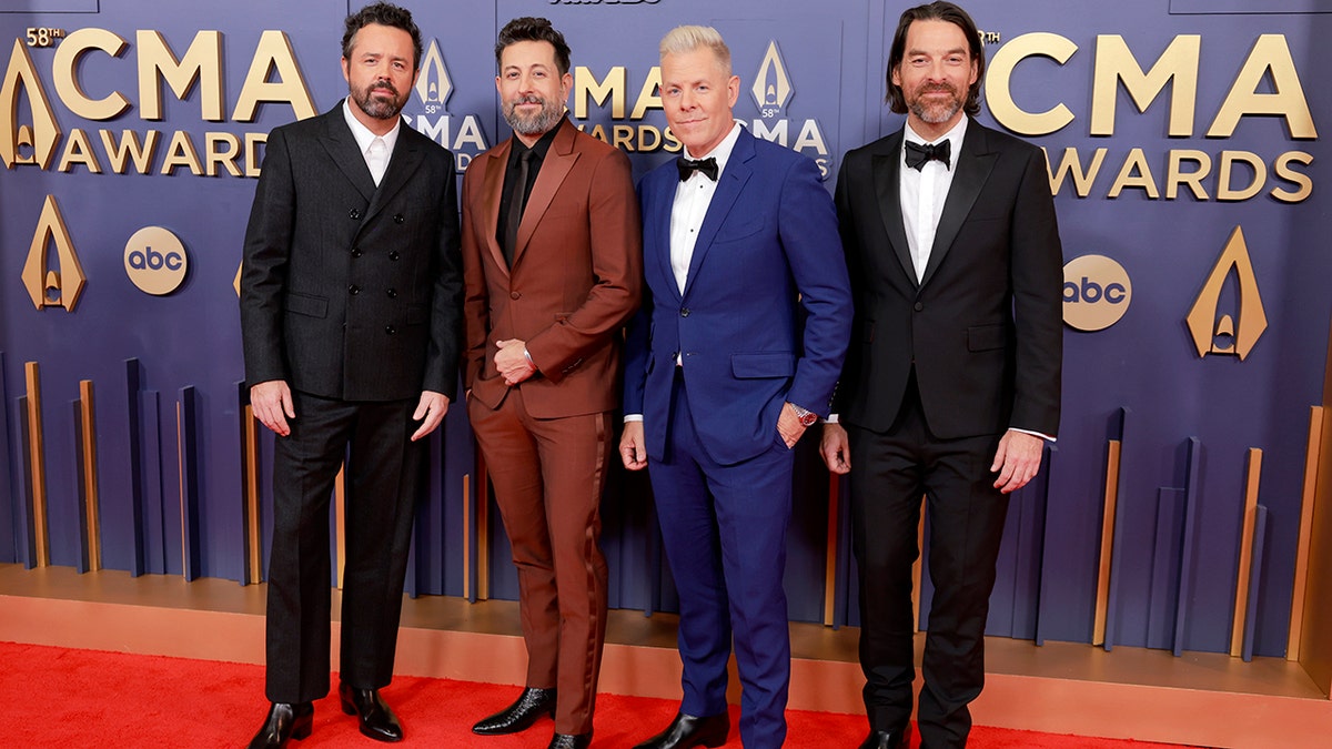 Members of Old Dominion walking the red carpet at the 2024 CMA Awards.