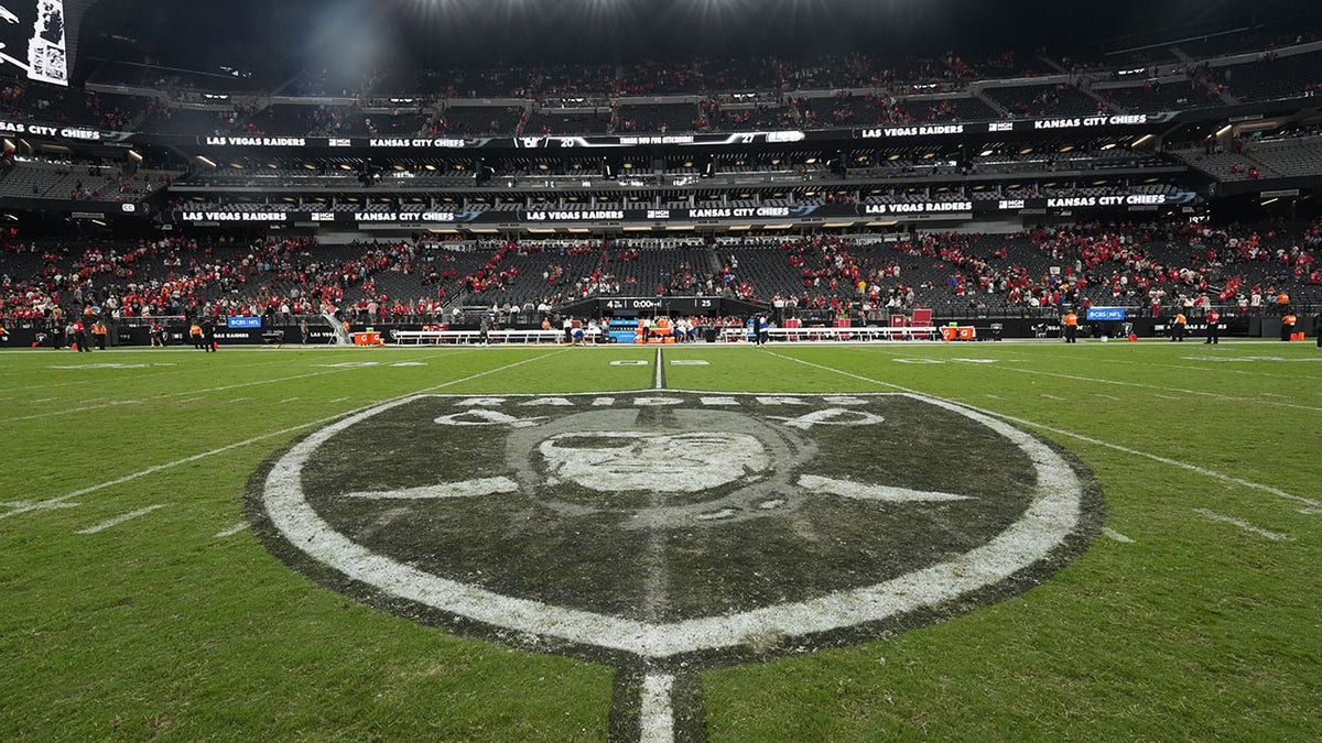 Las Vegas Raiders logo on the turf