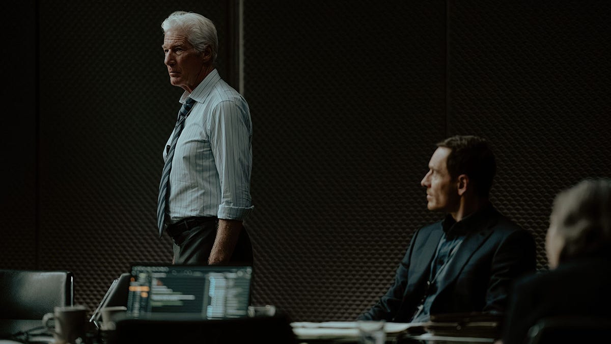 Richard Gere and Michael Fassbender in a scene from "The Agency."