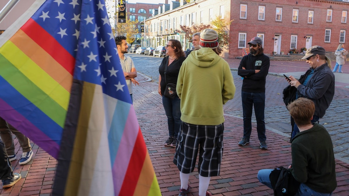 Protesters are in front of Rep. Seth Moulton’s office in Salem, Massachusetts, on Friday.