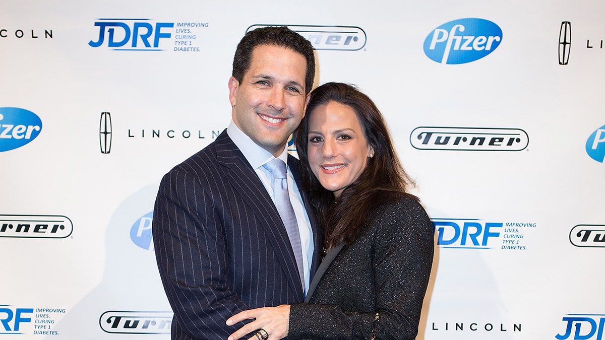 Adam Schefter with wife