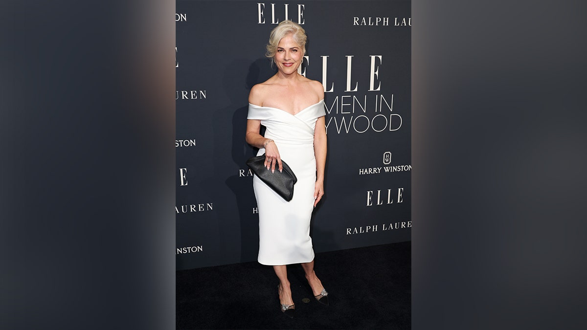 Selma Blair wore an off the shoulder white dress to the Elle Women of the Year event.