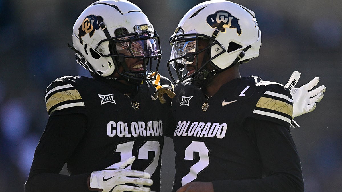 Shedeur Sanders and Travis Hunter celebrate