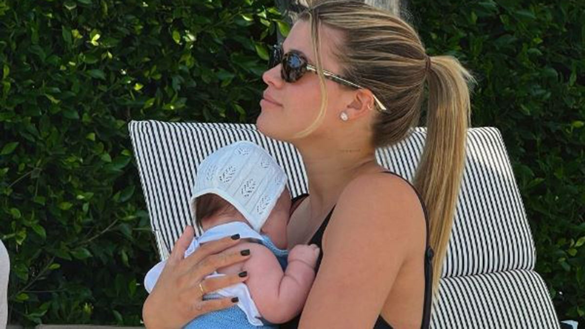 Sofia Richie holding her baby