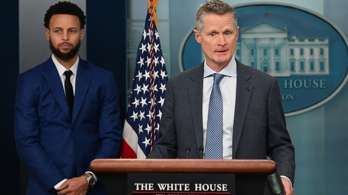 Golden State Warriors player Stephen Curry, left, looks on as U.S. basketball coach Steve Kerr speaks during the daily briefing in the Brady Briefing Room of the White House in Washington, D.C., on Jan. 17, 2023.