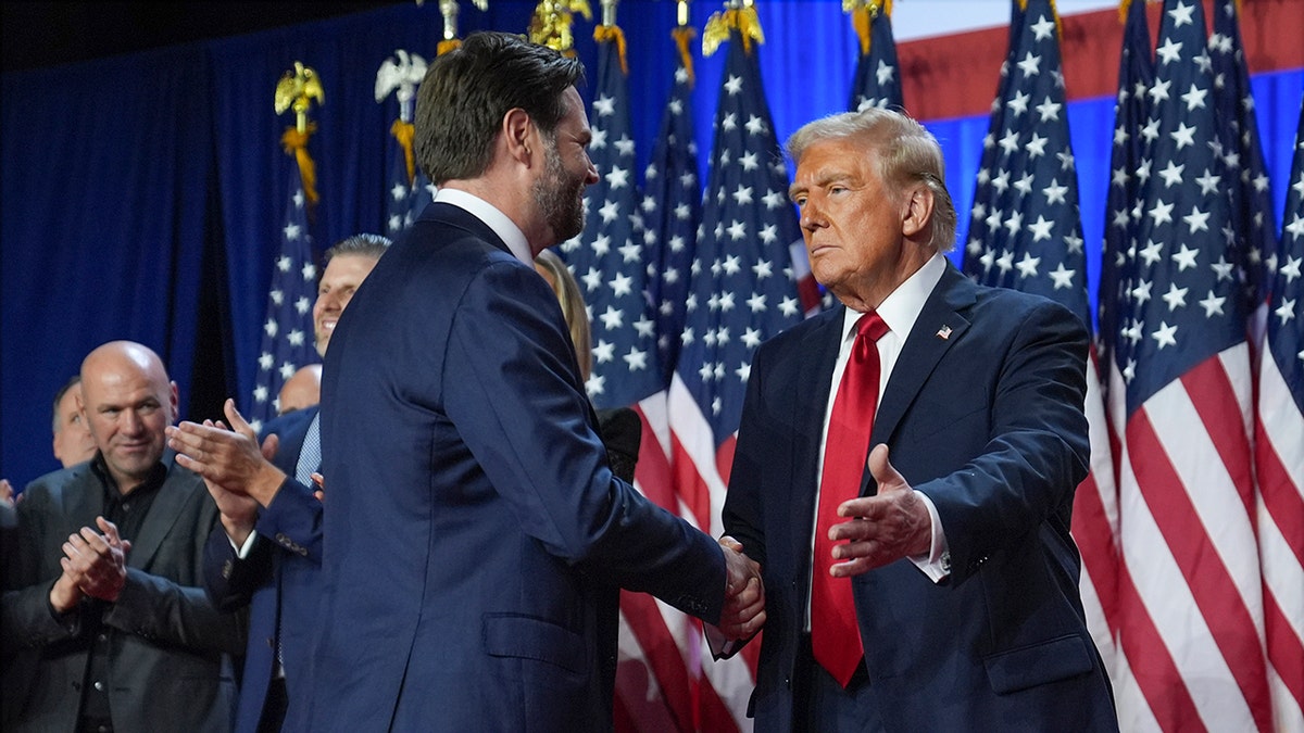 President-elect Donald Trump greets Vice President-elect JD Vance at an election night watch party in Palm Beach, Fla., on Nov. 6, 2024.