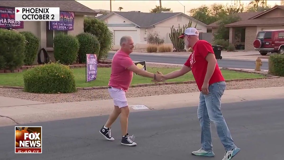 neighbors shake hands