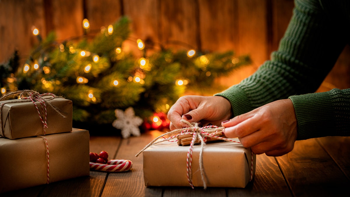 Woman wrapping Christmas gift