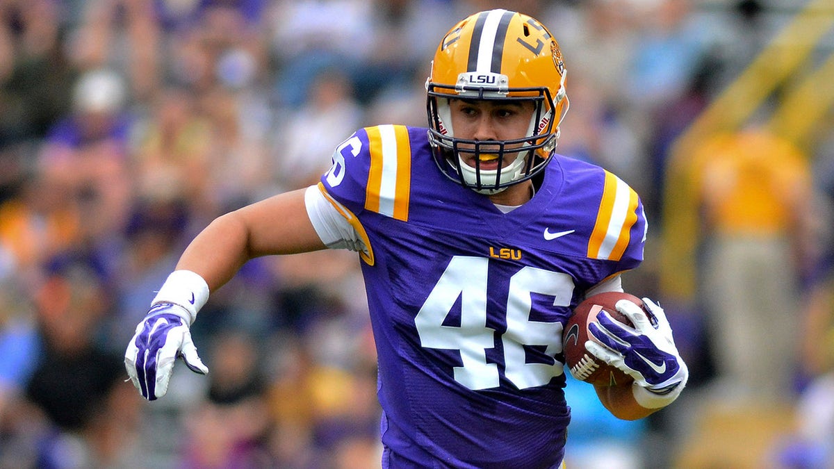 Zach Von Rosenberg carries the ball