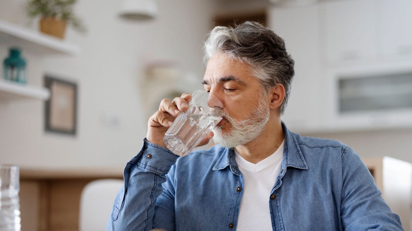 man drinking water