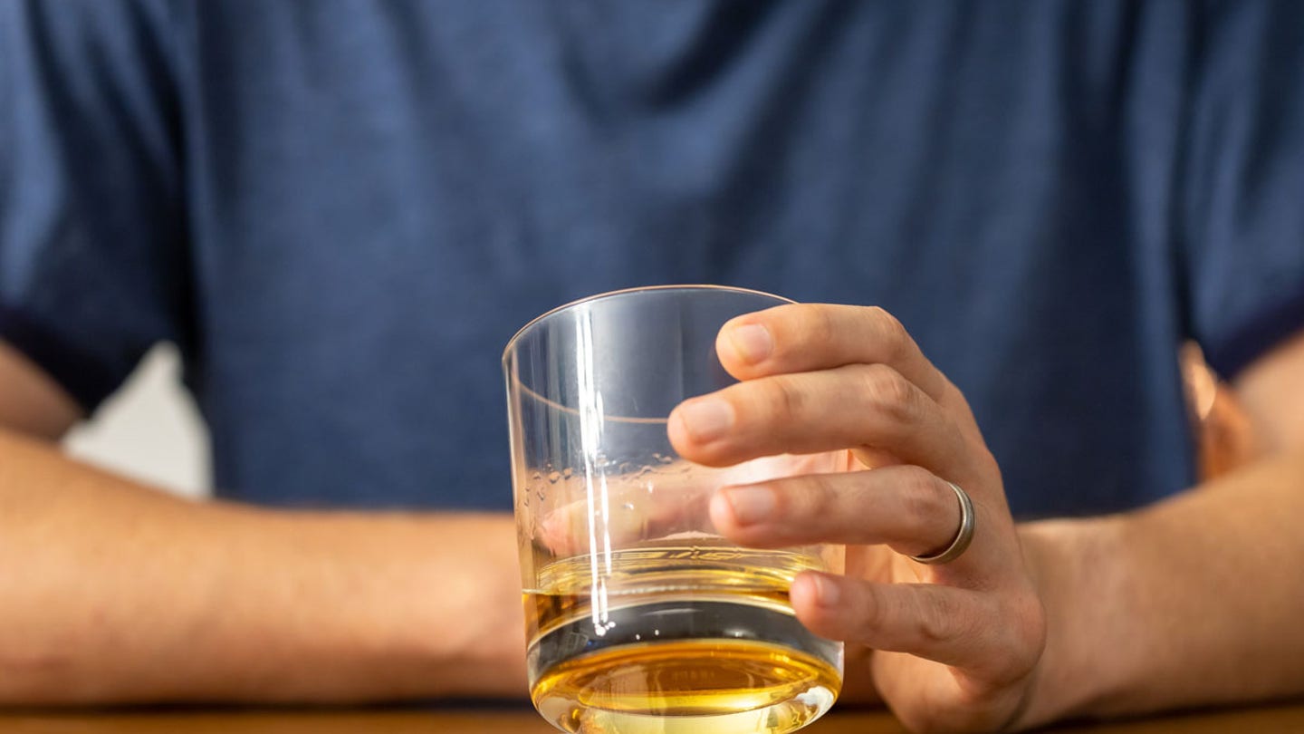 man drinking whiskey