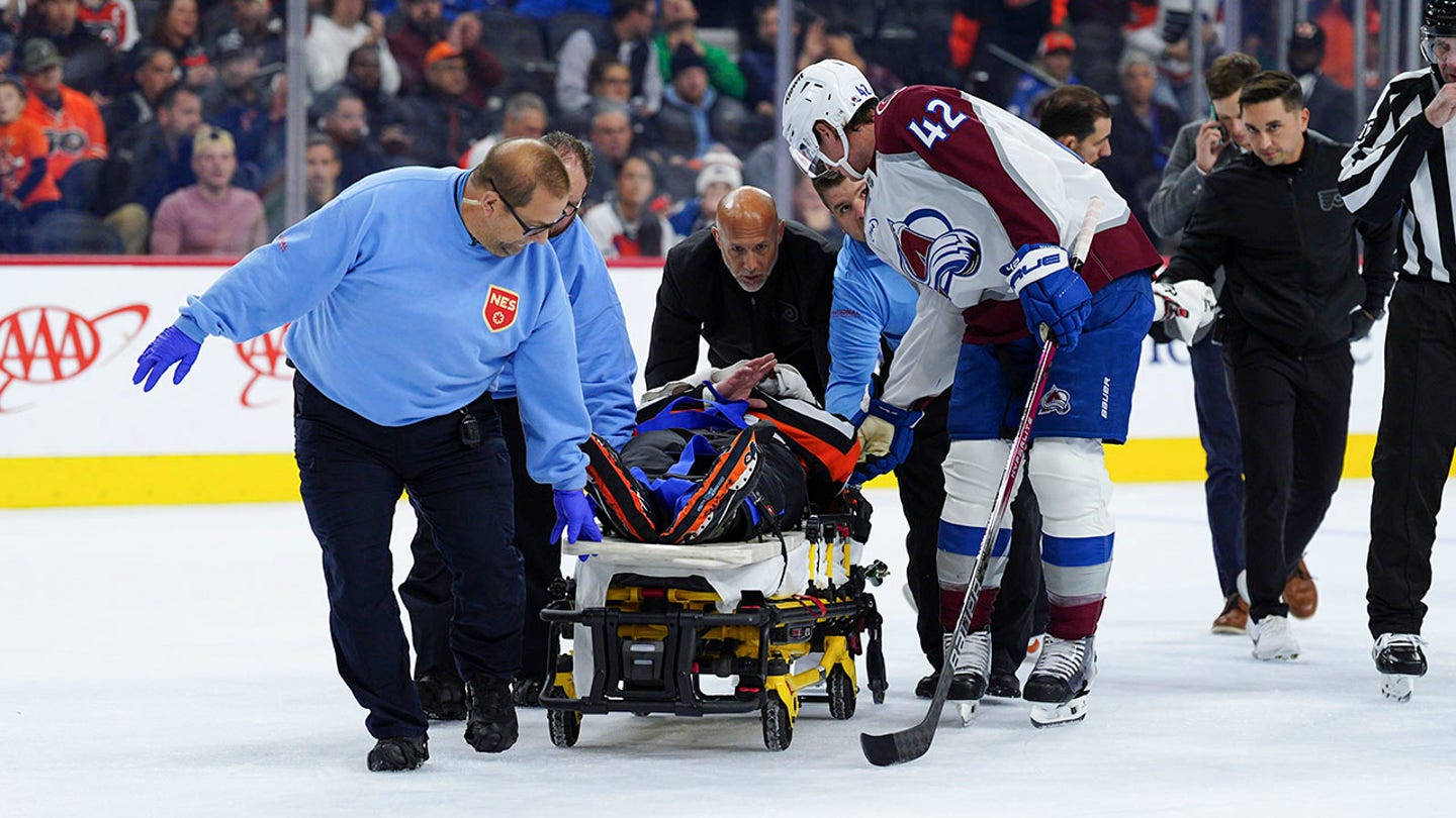 Referee Mitch Dunning Stretchered Off Ice After Collision With Avalanche Player