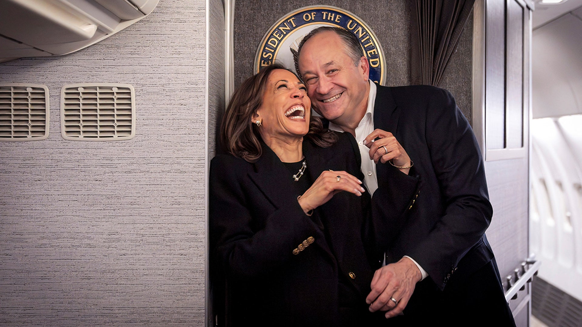 Democratic presidential nominee Vice President Kamala Harris shares a laugh with second gentleman Doug Emhoff