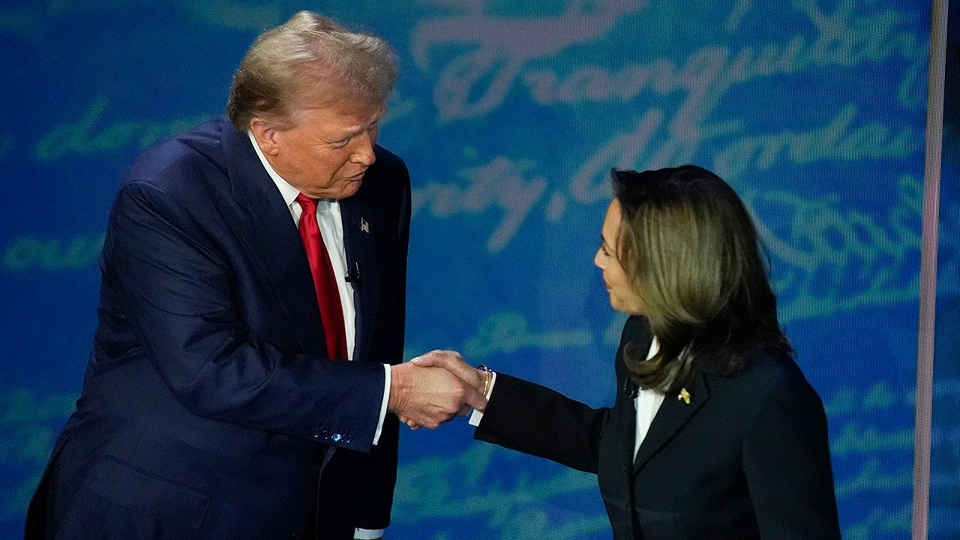 Republican presidential nominee former President Donald Trump and Democratic presidential nominee Vice President Kamala Harris shake hands before the start of an ABC News presidential debate