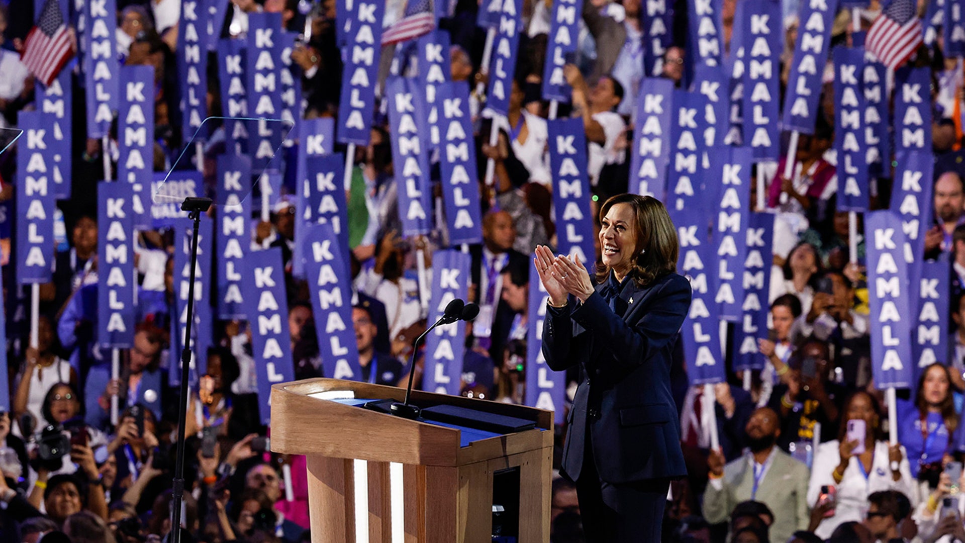 Democratic presidential candidate Vice President Kamala Harris arrives to speak on stage during the final day of the Democratic National Convention