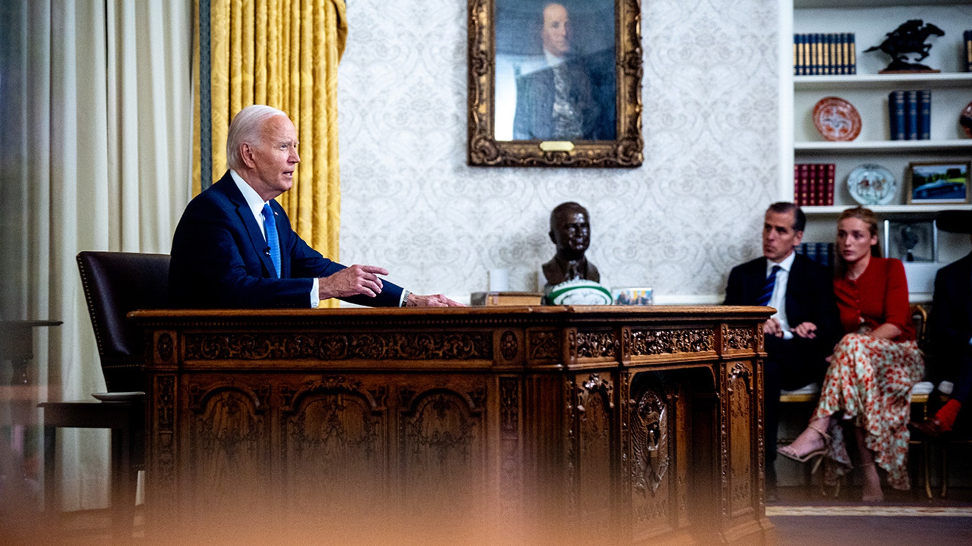 President Joe Biden, accompanied by his son Hunter Biden, Hunter's daughter Finnegan Biden, speaks during an address to the nation about his decision not to seek reelection