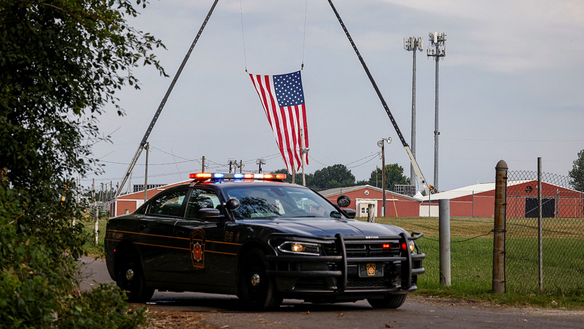 A state trooper car blocks an entrance to the event grounds where the rally was held during the law enforcement investigation into gunfire at a campaign rally of Republican presidential candidate and former President Donald Trump