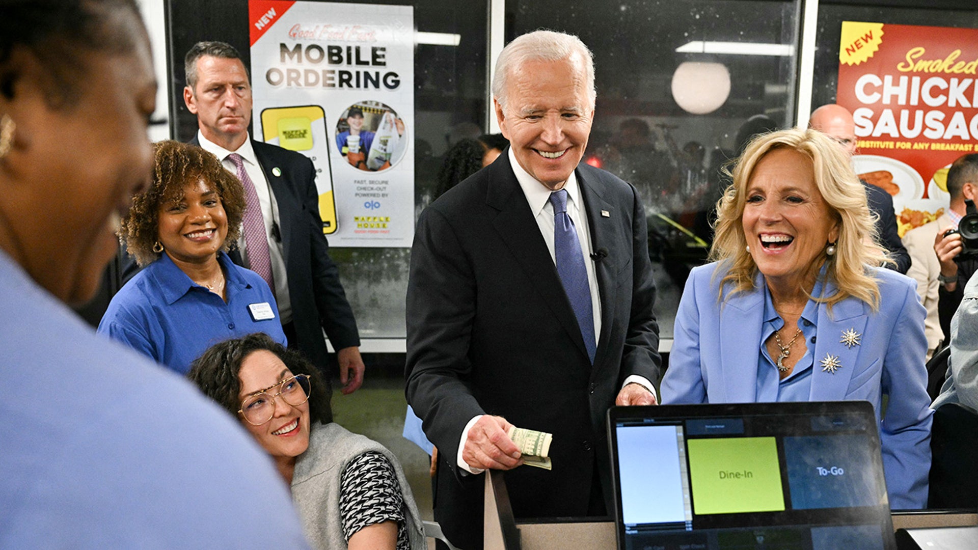 President Joe Biden and First Lady Jill Biden make a purchase as they visit a Waffle House after Biden participated in the first presidential debate