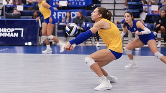 Women's college volleyball team praised for forfeiting title shot against trans player - Fox News