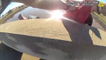 Sleeping man saved from rolling off bridge by police officer, Good Samaritan in dramatic video - Fox News