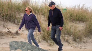 Biden appears to struggle while walking on beach with first lady