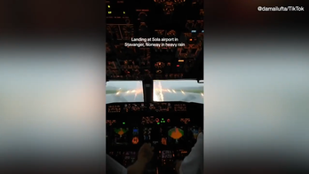 Flight attendant's viral video shows pilots landing in heavy rainstorm