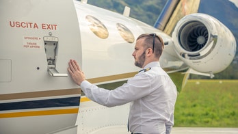 Flight passengers' ritual of touching airplane before boarding sparks mixed feelings among travelers