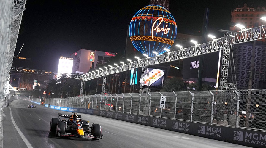 F1 drivers zoom down the straightaway at the Las Vegas Grand Prix