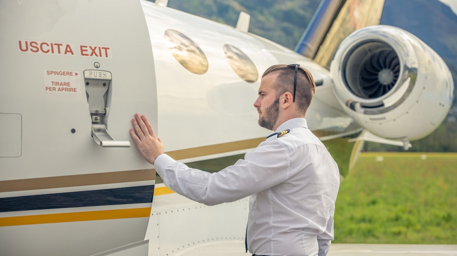 Flight passengers’ ritual of touching airplane before boarding sparks mixed feelings among travelers