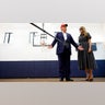 Republican presidential nominee former President Donald Trump and his wife Melania Trump talk to reporters after casting their votes at the polling place in the Morton and Barbara Mandel Recreation Center