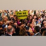 Supporters gather around Democratic presidential nominee Vice President Kamala Harris during her rally at Michigan State University