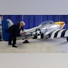Donald Trump signs a North American Aviation P-51 Mustang at a campaign rally