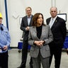 Democratic presidential nominee U.S. Vice President Kamala Harris meets with employees, with U.S. Rep. Dan Kildee and Corning CEO Wendell Weeks looking on