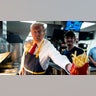 Republican presidential nominee and former President Donald Trump works behind the counter during a campaign event at McDonald's restaurant