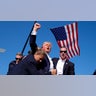 Donald Trump is surrounded by U.S. Secret Service agents at a campaign rally in Butler
