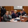 Former President Donald Trump appears in court with members of his legal team for an arraignment on charges stemming from his indictment by a Manhattan grand jury