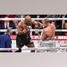 Mike Tyson lands punch