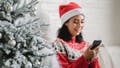 A woman looking at her new smartphone - Fox News