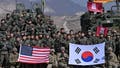 South Korean and US soldiers pose for photos after their joint live fire exercise at a military training field in Pocheon on March 14, 2024 as part of the annual Freedom Shield joint military exercise between South Korea and the United States. (Photo by JUNG YEON-JE / POOL / AFP) (Photo by JUNG YEON-JE/POOL/AFP via Getty Images) - Fox News