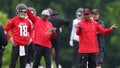 Kirk Cousins #18 looks on as head coach Raheem Morris of the Atlanta Falcons speaks to the offense and defense during OTA offseason workouts at the Atlanta Falcons training facility on May 14, 2024 in Flowery Branch, Georgia. - Fox News