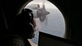 Flight officer Rayan Gharazeddine scans the water in the southern Indian Ocean off Australia from a Royal Australian Air Force AP-3C Orion during a search for the missing Malaysia Airlines Flight MH370, March 22, 2014. - Fox News