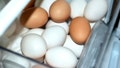 A variety of white and brown eggs are seen in a refrigerator compartment. - Fox News